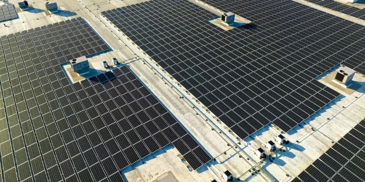 Solar panels for Shops and Retail. An image of solar panels fully installed on the available roof space of a large building.